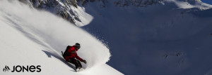 Snowboarder in Big Mountain Powder on Jones Snowboard Rental Demo - JH Skis